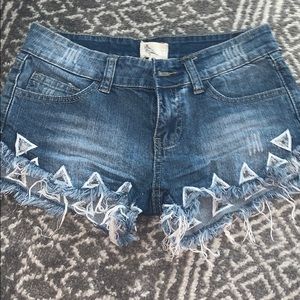 Cutoff jean shorts with cutouts